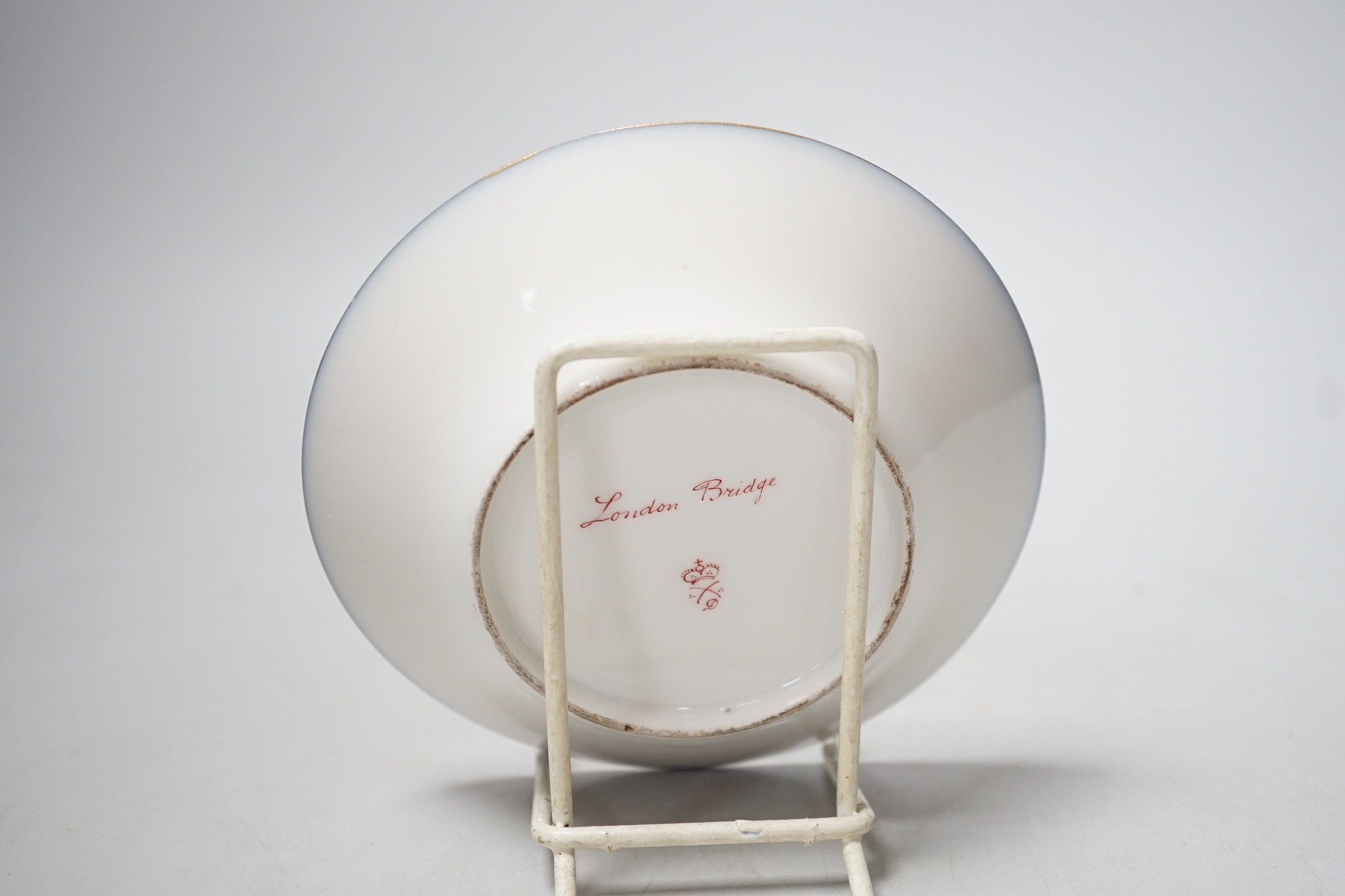 A Continental Derby style cup and saucer, 8cm tall overall